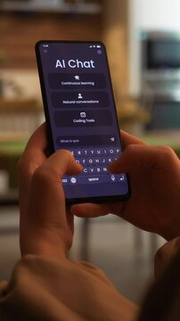 Chatting with artificial intelligence online. Writing prompt and asking language model. Ai chat bot is having a conversation with human. Fictional Interface, vertical video.