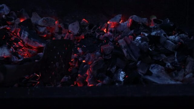 hot coals in a metal brazier close-up


