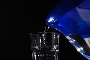 Modern water filter on a black background