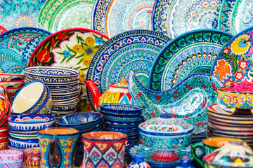 Multicolored ceramic dishes with oriental ornaments at the Siab Bazaar.
