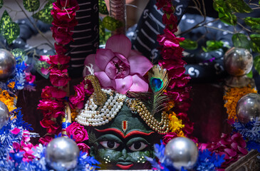 Shivling or shiv lingam decorated with colours and flowers to worship lord shiv. Selective focus.