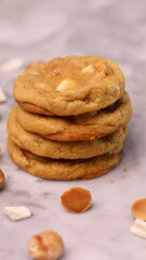 The cookies are golden brown with a slightly crispy edge and a soft, chewy center. Some cookies have chocolate chips