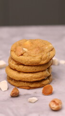 The cookies are golden brown with a slightly crispy edge and a soft, chewy center. Some cookies have chocolate chips