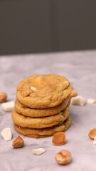 The cookies are golden brown with a slightly crispy edge and a soft, chewy center. Some cookies have chocolate chips