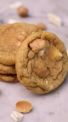 The cookies are golden brown with a slightly crispy edge and a soft, chewy center. Some cookies have chocolate chips
