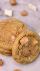 The cookies are golden brown with a slightly crispy edge and a soft, chewy center. Some cookies have chocolate chips