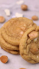 The cookies are golden brown with a slightly crispy edge and a soft, chewy center. Some cookies have chocolate chips