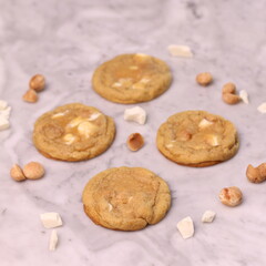 The cookies are golden brown with a slightly crispy edge and a soft, chewy center. Some cookies have chocolate chips