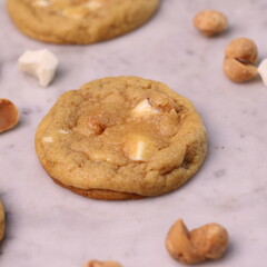The cookies are golden brown with a slightly crispy edge and a soft, chewy center. Some cookies have chocolate chips