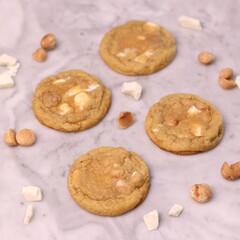 The cookies are golden brown with a slightly crispy edge and a soft, chewy center. Some cookies have chocolate chips