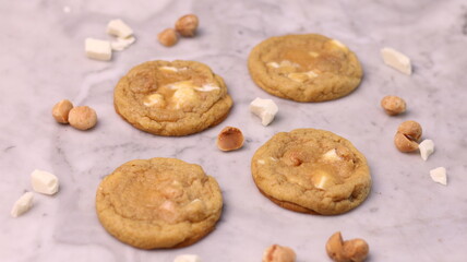 The cookies are golden brown with a slightly crispy edge and a soft, chewy center. Some cookies have chocolate chips