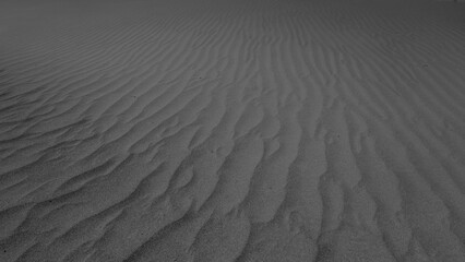 Abstract pattern made due to wind erosion on shifting sand dunes.
