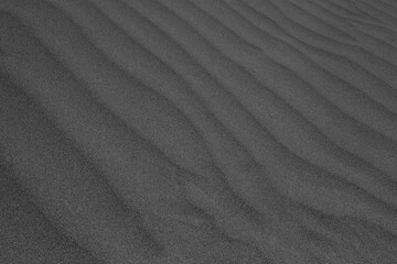 Abstract pattern made due to wind erosion on shifting sand dunes.