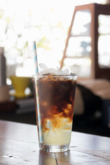 Refreshing iced coffee drink served in a clear glass with ice, capturing a perfect moment of relaxation and enjoyment.