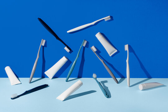 Variety of dental hygiene products on blue background