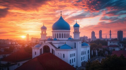White buildings and blue domes stand out against the fiery hues of a sunset, creating a mesmerizing and iconic view.