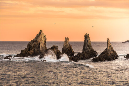 Sunrise at Gueirua Beach with rocky outcrops - Powered by Adobe