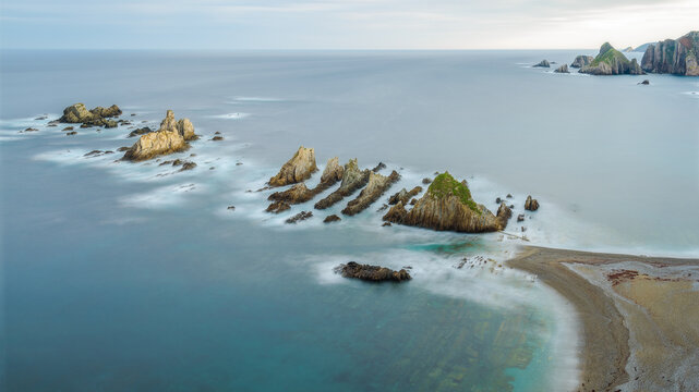 Aerial Sunrise at Asturias' Gueirua Beach with Rocky Landscape