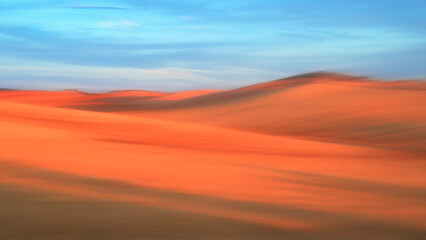 Serene desert landscape at sunset with soft focus