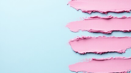 Obraz premium Pastel pink brush strokes on soft blue backdrop