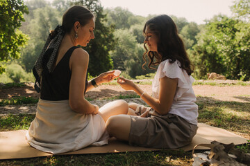 Mentor and student before Mindful meditation and yoga in an open area. Deep relaxation and inner...
