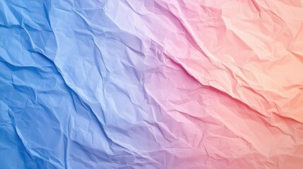 Obraz premium Crumpled paper texture in blue and pink hues creates soft, artistic background. gentle color gradient evokes sense of calm and creativity. 