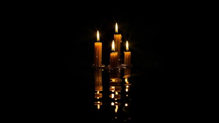 Photo of Candlemas, Light of the World, Christian holiday, burning candles on black background with reflection.
