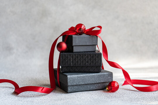 Elegant Christmas gifts with red ribbons and ornaments - Powered by Adobe