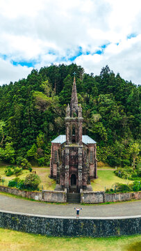 Majestic vintage church surrounded by lush Azores forest