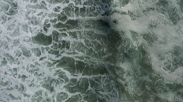 Aerial view of waves crashing at Strands Beach in Dana Point, California