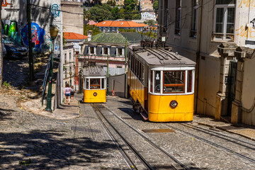 Old yellow trams on the street in Lisbon