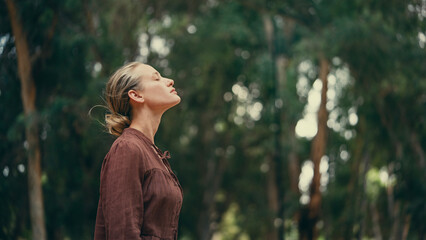 Woman breathing fresh air outdoors	