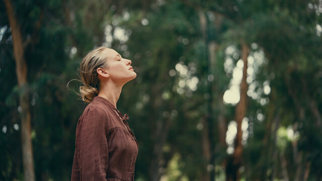 Woman breathing fresh air outdoors	