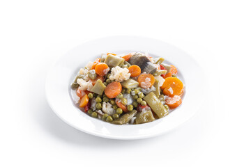 Menestra de verduras or Spanish vegetable stew isolated on white background