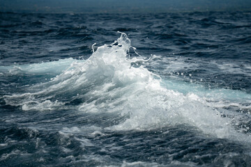 Blue ocean water waves splashing