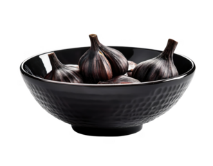 Black garlic bulbs in bowl cut out transparent isolated on white background PNG