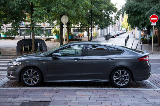 Mulhouse - France - 22 August 2024 - profile view of grey ford mondeo parked in the street