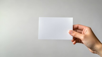 hand holding blank business card