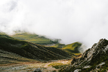 cloudy foggy mountain green italy