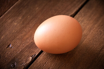 Egg on a rustic wooden board