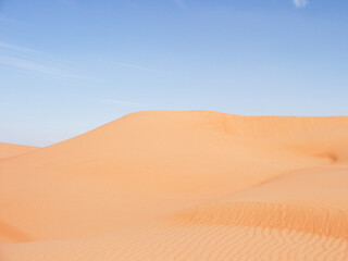 Sand Dunes in Oman Desert against blue sky, Middle East