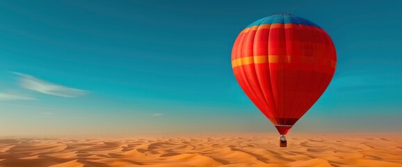 Fototapeta premium Hot Air Balloon Soaring Over Desert Dunes