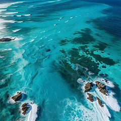 Fototapeta premium Aerial view beautiful of sea waves from drone. Stock image of blue color of ocean water, sea surface, sunset. Top view on turquoise waves, clear water surface texture.