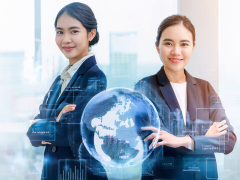 Global Business Technology Concept with Two Confident Asian Female Professionals