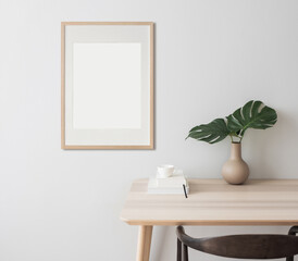 Blank picture frame mockup on wall in modern minimalist interior. Artwork template mock up in scandinavian interior design. Home staging and minimalism concept