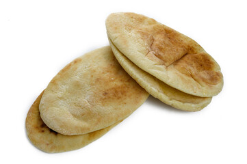 Cut fresh pita bread on white background, top view