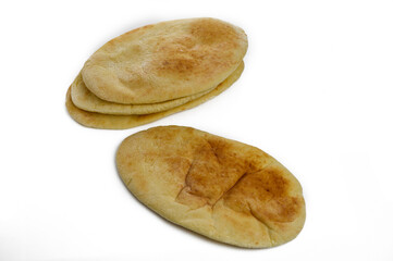 Loaves of delicious fresh pita bread on white background