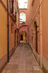 A street between old houses of Isernia, a city in Molise,  Italy.