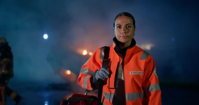 Portrait of Beautiful, Multiethnic, Female Paramedic on Late Night Call at a Traffic Accident Scene. Heroic Empowering Woman Posing for Camera, Reporting for Duty to Save Lives