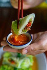 Close-up the steamed cabbage with minced meat roll serving on the white plate. Healthy recipe, low calorie and diet food